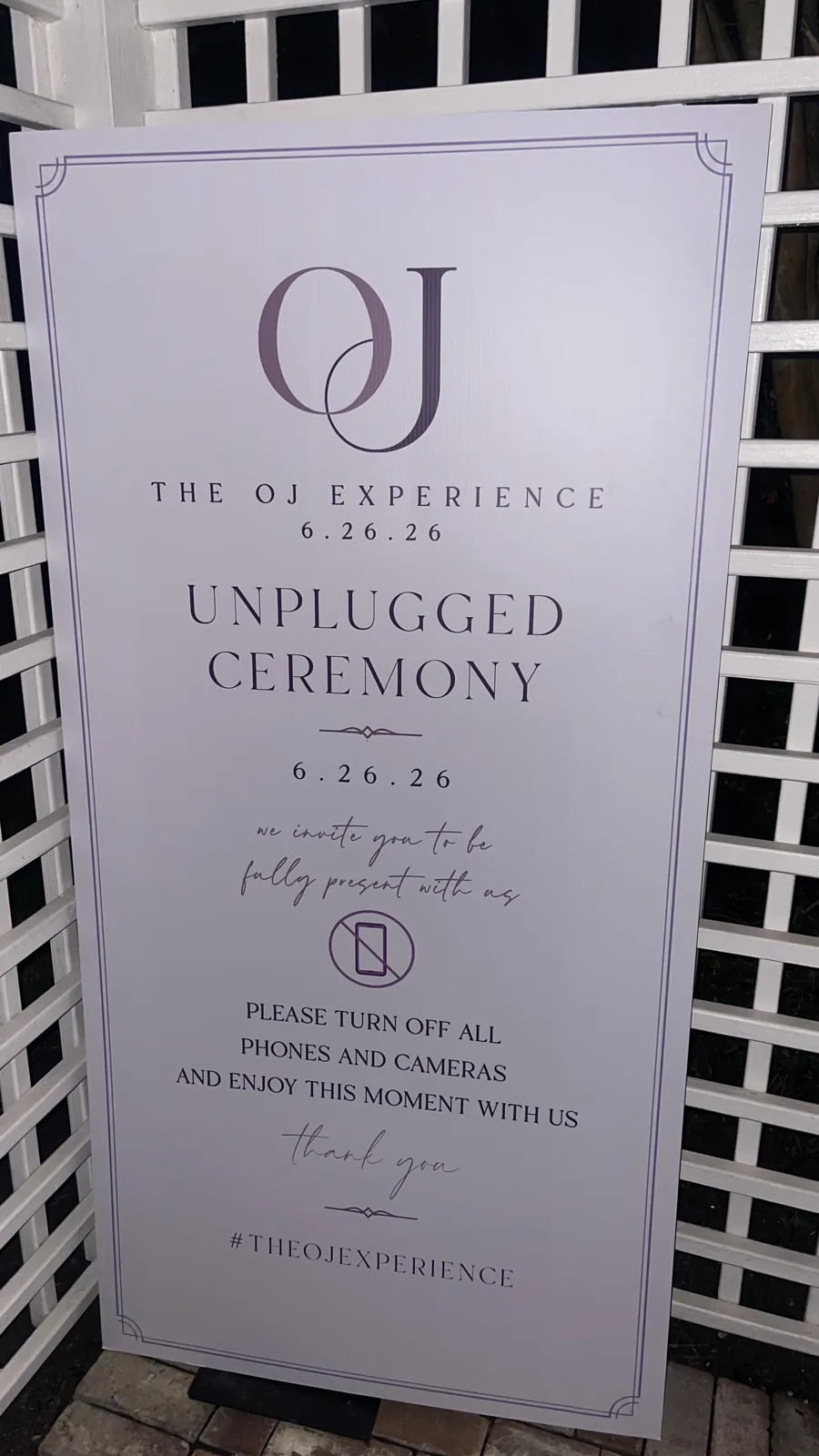 A custom unplugged ceremony sign asking guests to put their phones away