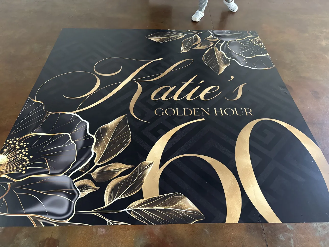 A black and gold dance floor wrap for Katie's 60th Golden Hour birthday