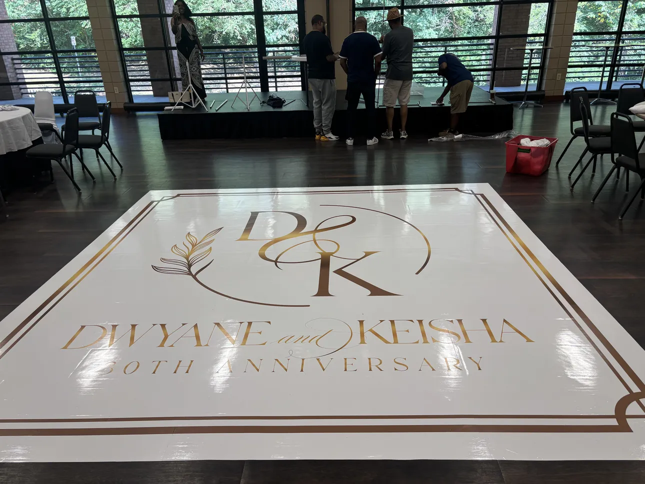 A white and gold monogram dance floor wrap for Dwyane and Keisha's anniversary