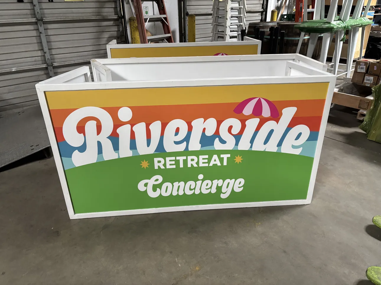 A bright Riverside Retreat Concierge bar wrap