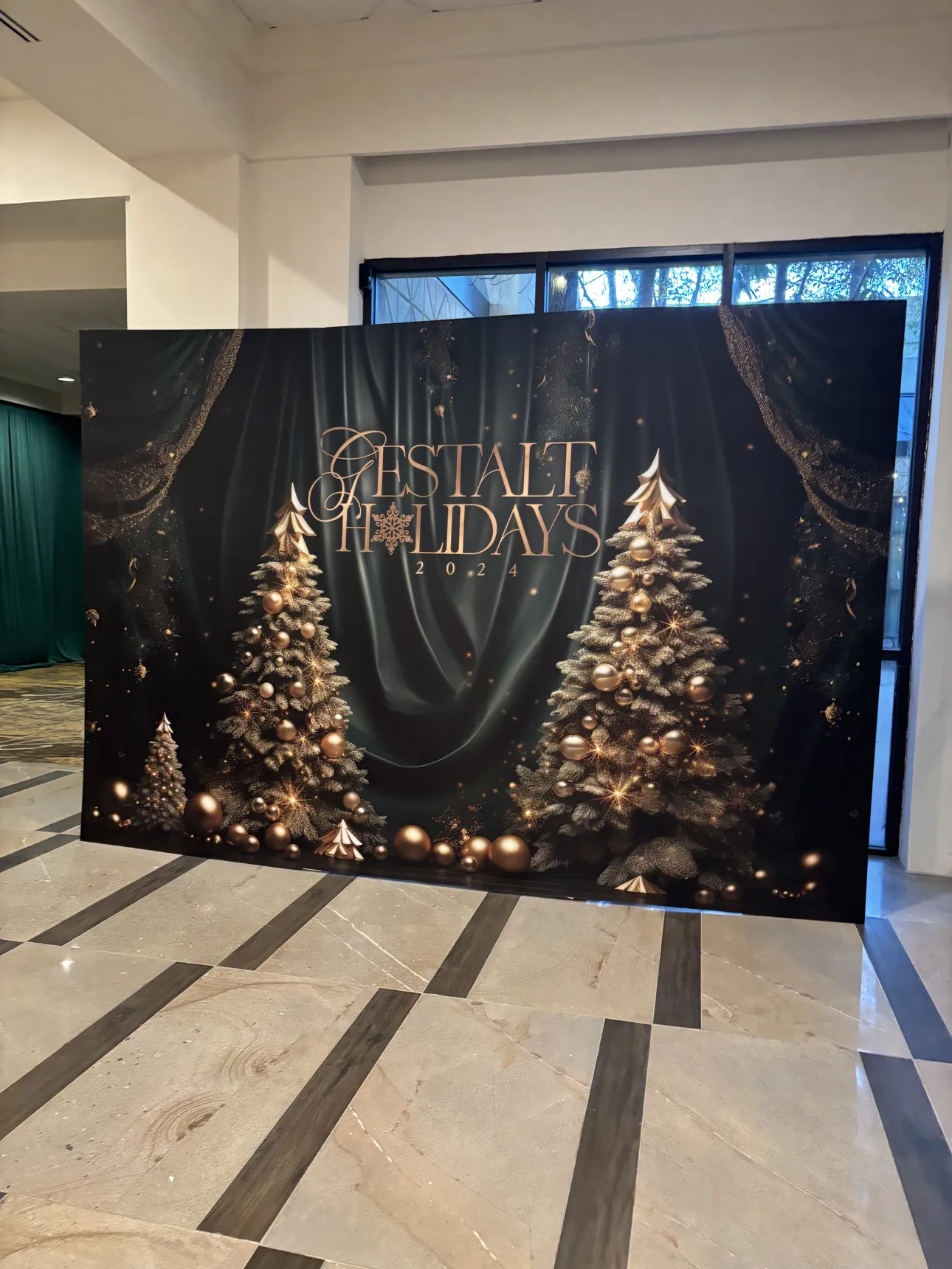 A Christmas tree photo backdrop for a holiday party