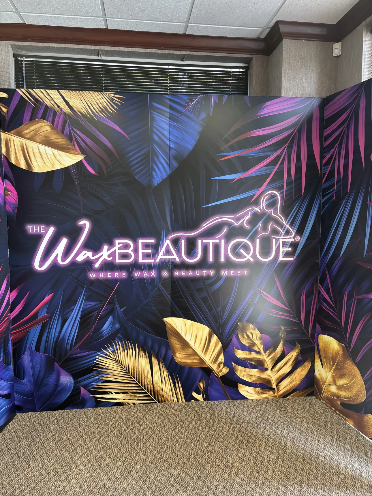 A tropical Wax Beautique photo backdrop